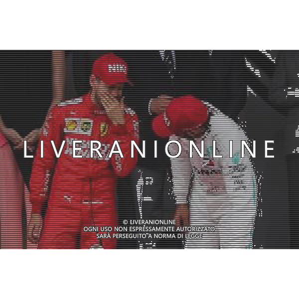 (L to R): Sebastian Vettel (GER) Ferrari on the podium with race winner Lewis Hamilton (GBR) Mercedes AMG F1. 26.05.2019. Formula 1 World Championship, Rd 6, Monaco Grand Prix, Monte Carlo, Monaco, Race Day. / AGENZIA ALDO LIVERANI SAS - ITALY ONLY EDITORIAL USE ONLY