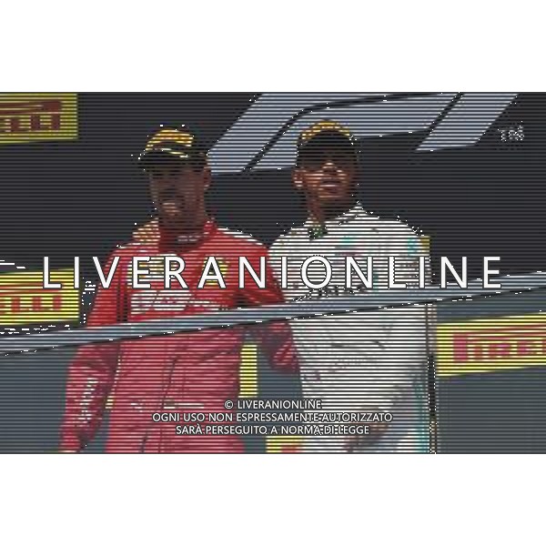 (L to R): second placed Sebastian Vettel (GER) Ferrari on the podium with race winner Lewis Hamilton (GBR) Mercedes AMG F1. 09.06.2019. Formula 1 World Championship, Rd 7, Canadian Grand Prix, Montreal, Canada, Race Day. / AGENZIA ALDO LIVERANI SAS - ITALY ONLY EDITORIAL USE ONLY