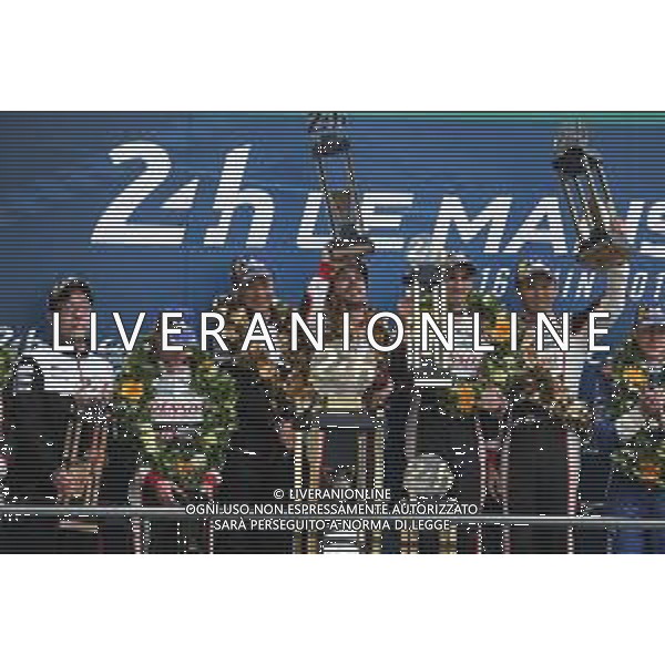 (L to R): Race winners Fernando Alonso (ESP); Sebastien Buemi (SUI); and Kazuki Nakajima (JPN) #08 Toyota Gazoo Racing Toyota TS050 Hybrid celebrate on the podium. 16.06.2019. FIA World Endurance Championship, Le Mans 24 Hours, Race, Le Mans, France. Sunday.