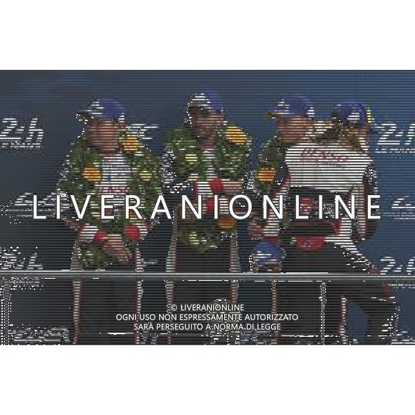 (L to R): second placed Kamui Kobayashi (JPN); Jose Maria Lopez (ARG); and Mike Conway (GBR) #07 Toyota Gazoo Racing Toyota TS050 Hybrid, on the podium. 16.06.2019. FIA World Endurance Championship, Le Mans 24 Hours, Race, Le Mans, France. Sunday.