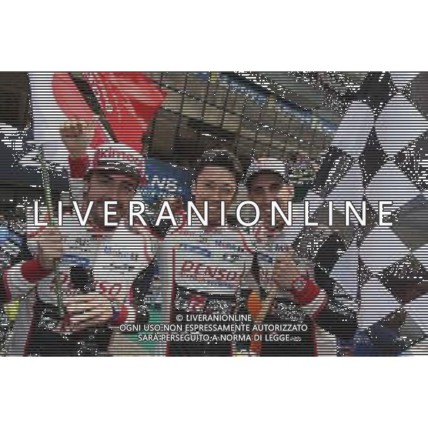 (L to R): Race winners Fernando Alonso (ESP), Kazuki Nakajima (JPN), and Sebastien Buemi (SUI) #08 Toyota Gazoo Racing Toyota TS050 Hybrid, celebrate in parc ferme. 16.06.2019. FIA World Endurance Championship, Le Mans 24 Hours, Race, Le Mans, France. Sunday.