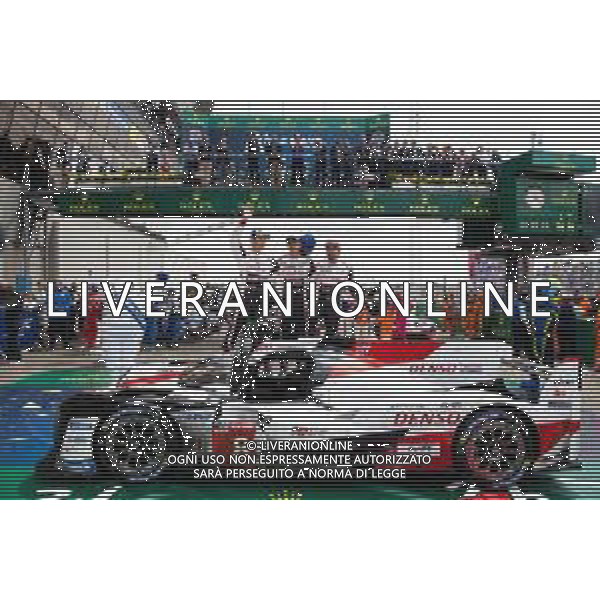 (L to R): Race winners Kazuki Nakajima (JPN) /Sebastien Buemi (SUI) / Fernando Alonso (ESP) #08 Toyota Gazoo Racing Toyota TS050 Hybrid, celebrate in parc ferme. 16.06.2019. FIA World Endurance Championship, Le Mans 24 Hours, Race, Le Mans, France. Sunday.