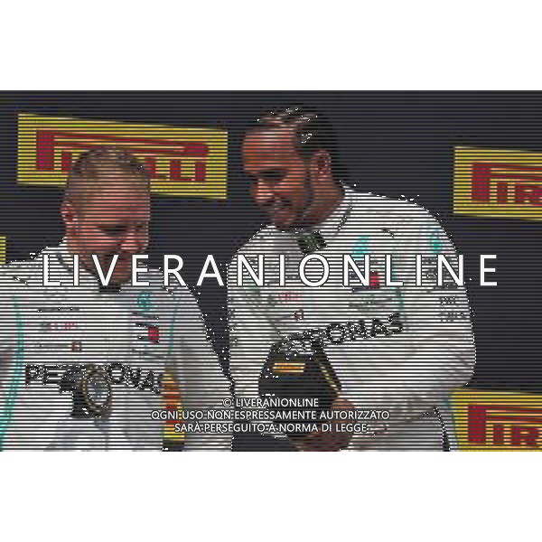 (L to R): Second placed Valtteri Bottas (FIN) Mercedes AMG F1 on the podium with race winner Lewis Hamilton (GBR) Mercedes AMG F1. 23.06.2019. Formula 1 World Championship, Rd 8, French Grand Prix, Paul Ricard, France, Race Day. AG ALDO LIVERANI SAS-ONLY ITALY
