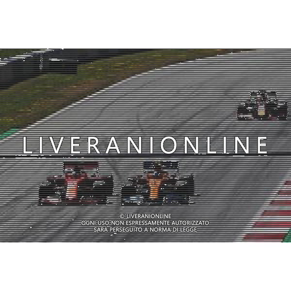 (L to R): Sebastian Vettel (GER) Ferrari SF90 and Lando Norris (GBR) McLaren MCL34 battle for position. 30.06.2019 Formula 1 World Championship, Rd 9, Austrian Grand Prix, Spielberg, Austria, Race Day. / AGENZIA ALDO LIVERANI SAS - ITALY ONLY EDITORIAL USE ONLY