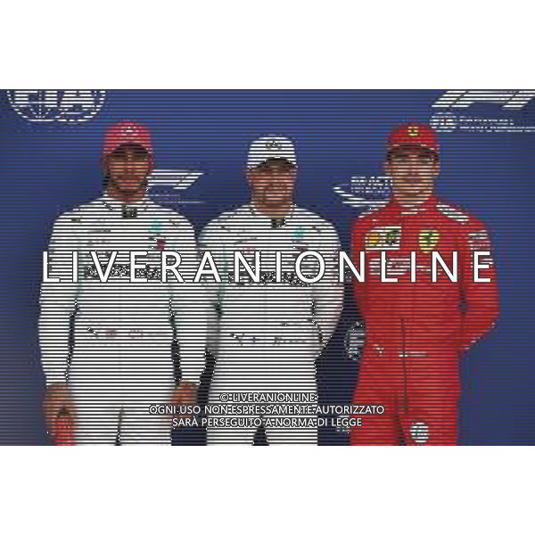 Qualifying top three in parc ferme (L to R): Lewis Hamilton (GBR) Mercedes AMG F1, second; Valtteri Bottas (FIN) Mercedes AMG F1, pole position; Charles Leclerc (MON) Ferrari, third. 13.07.2019. Formula 1 World Championship, Rd 10, British Grand Prix, Silverstone, England, Qualifying Day. / AGENZIA ALDO LIVERANI SAS - ITALY ONLY EDITORIAL USE ONLY