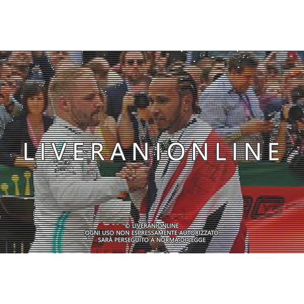 Race winner Lewis Hamilton (GBR) Mercedes AMG F1 celebrates with team mate Valtteri Bottas (FIN) Mercedes AMG F1 in parc ferme. 14.07.2019. Formula 1 World Championship, Rd 10, British Grand Prix, Silverstone, England, Race Day. AG ALDO LIVERANI SAS-ONLY ITALY