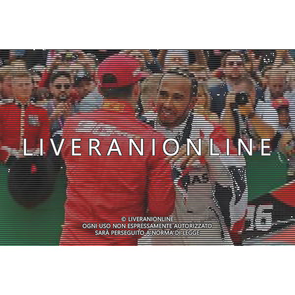 Race winner Lewis Hamilton (GBR) Mercedes AMG F1 celebrates with Charles Leclerc (MON) Ferrari in parc ferme. 14.07.2019. Formula 1 World Championship, Rd 10, British Grand Prix, Silverstone, England, Race Day. AG ALDO LIVERANI SAS-ONLY ITALY
