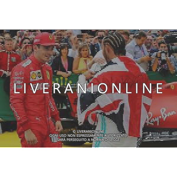 Race winner Lewis Hamilton (GBR) Mercedes AMG F1 celebrates with Charles Leclerc (MON) Ferrari in parc ferme. 14.07.2019. Formula 1 World Championship, Rd 10, British Grand Prix, Silverstone, England, Race Day. AG ALDO LIVERANI SAS-ONLY ITALY