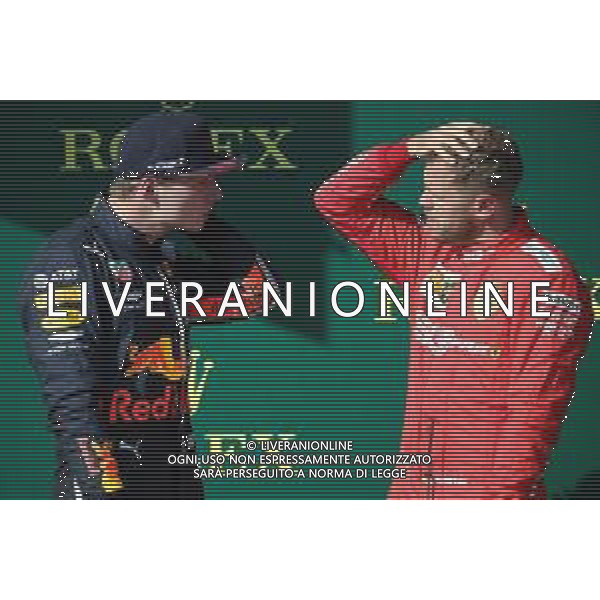 Max Verstappen (NLD) Red Bull Racing RB15 and Sebastian Vettel (GER) Ferrari SF90. 04.08.2019. Formula 1 World Championship, Rd 12, Hungarian Grand Prix, Budapest, Hungary, Race Day. AG ALDO LIVERANI SAS-ONLY ITALY