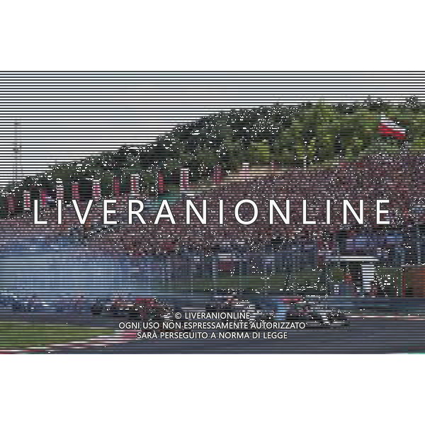 (L to R): Max Verstappen (NLD) Red Bull Racing RB15; Valtteri Bottas (FIN) Mercedes AMG F1 W10; and Lewis Hamilton (GBR) Mercedes AMG F1 W10, at the start of the race. 04.08.2019. Formula 1 World Championship, Rd 12, Hungarian Grand Prix, Budapest, Hungary, Race Day. AG ALDO LIVERANI SAS-ONLY ITALY