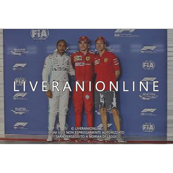 Qualifying top three in parc ferme (L to R): Lewis Hamilton (GBR) Mercedes AMG F1, second; Charles Leclerc (MON) Ferrari, pole position; Sebastian Vettel (GER) Ferrari, third. 21.09.2019. Formula 1 World Championship, Rd 15, Singapore Grand Prix, Marina Bay Street Circuit, Singapore, Qualifying Day. AG ALDO LIVERANI SAS-ONLY ITALY