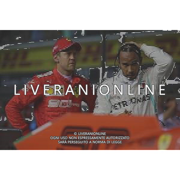 Sebastian Vettel (GER) Ferrari SF90 and Lewis Hamilton (GBR) Mercedes AMG F1 W10. 21.09.2019. Formula 1 World Championship, Rd 15, Singapore Grand Prix, Marina Bay Street Circuit, Singapore, Qualifying Day. AG ALDO LIVERANI SAS-ONLY ITALY