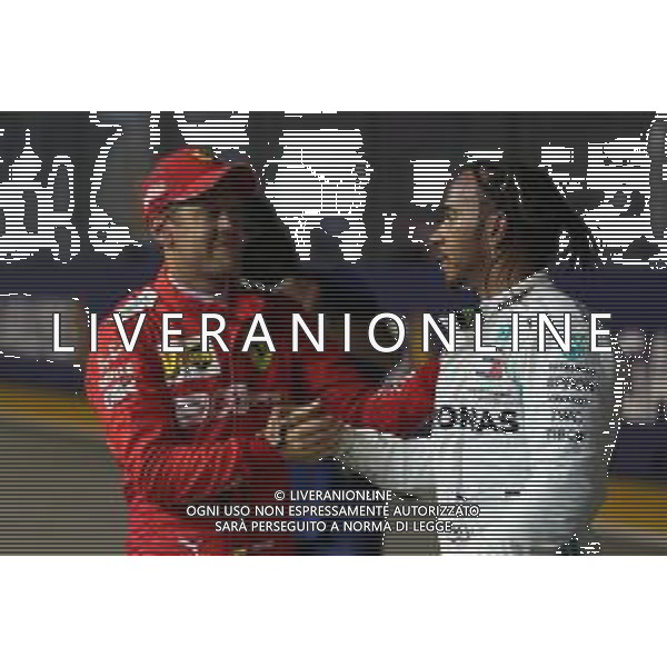Sebastian Vettel (GER) Ferrari SF90 and Lewis Hamilton (GBR) Mercedes AMG F1 W10. 21.09.2019. Formula 1 World Championship, Rd 15, Singapore Grand Prix, Marina Bay Street Circuit, Singapore, Qualifying Day. AG ALDO LIVERANI SAS-ONLY ITALY