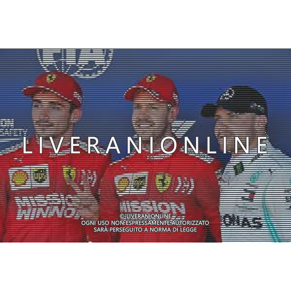 Qualifying top three in parc ferme (L to R): Charles Leclerc (MON) Ferrari, second; Sebastian Vettel (GER) Ferrari, pole position; Valtteri Bottas (FIN) Mercedes AMG F1, third. 13.10.2019. Formula 1 World Championship, Rd 17, Japanese Grand Prix, Suzuka, Japan, Sunday. AG ALDO LIVERANI SAS-ONLY ITALY