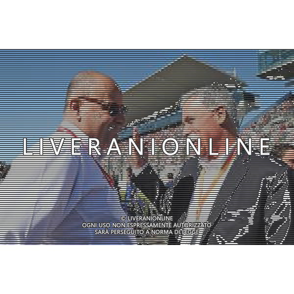 (L to R): Luca Colajanni (ITA) Formula One Senior Communications Officer with Chase Carey (USA) Formula One Group Chairman on the grid. 13.10.2019. Formula 1 World Championship, Rd 17, Japanese Grand Prix, Suzuka, Japan, Sunday. AG ALDO LIVERANI SAS-ONLY ITALY