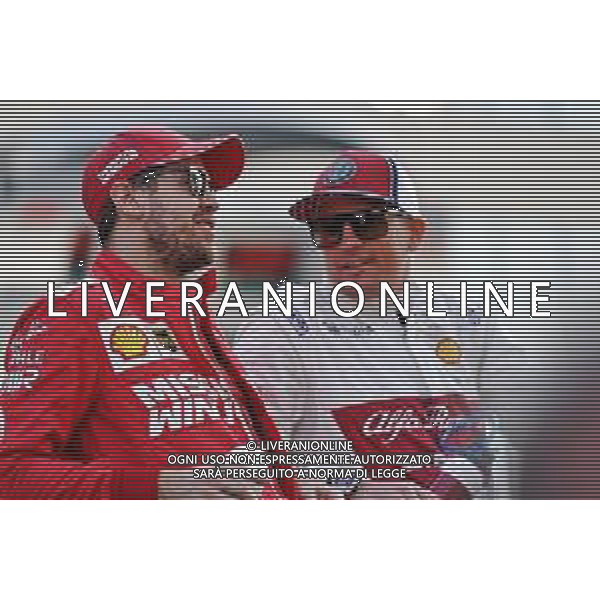 (L to R): Sebastian Vettel (GER) Ferrari with Kimi Raikkonen (FIN) Alfa Romeo Racing on the drivers parade. 01.12.2019. Formula 1 World Championship, Rd 21, Abu Dhabi Grand Prix, Yas Marina Circuit, Abu Dhabi, Race Day. AG ALDO LIVERANI SAS-ONLY ITALY