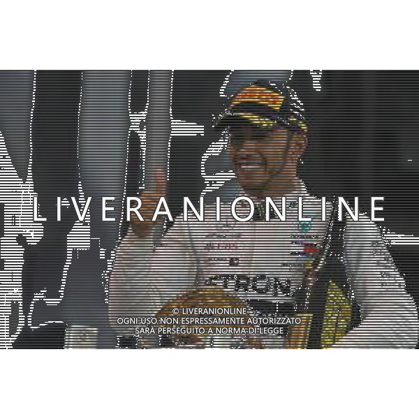 Race winner Lewis Hamilton (GBR) Mercedes AMG F1 celebrates on the podium. 01.12.2019. Formula 1 World Championship, Rd 21, Abu Dhabi Grand Prix, Yas Marina Circuit, Abu Dhabi, Race Day. AG ALDO LIVERANI SAS-ONLY ITALY