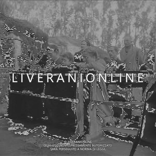 Bruno Cornacchiola, (che negli anni \'40 aveva in progetto di uccidere Papa Pio XII ) veggente, nell\'abbazia delle tre fontane, grotta del santuario vergine della rivelazione Roma anni \'50 - Retrospettiva Nella foto con la moglie Iolanda e i figli Gianfranco, Carlo e Isola ©Archivio Giovanni Liverani / AGENZIA ALDO LIVERANI SAS
