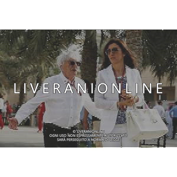 Bernie Ecclestone (GBR) with his wife Fabiana Flosi (BRA). 08.04.2018. Formula 1 World Championship, Rd 2, Bahrain Grand Prix, Sakhir, Bahrain, Race Day. / AGENZIA ALDO LIVERANI SAS - ITALY ONLY EDITORIAL USE ONLY - Bernie Ecclestone (GBR) con la moglie Fabiana Flosi (BRA).