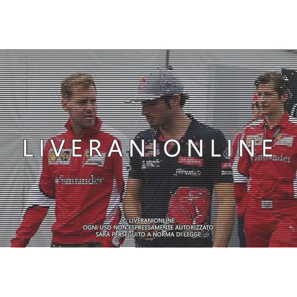 (L to R): Sebastian Vettel (GER) Ferrari with Carlos Sainz Jr (ESP) Scuderia Toro Rosso. 05.06.2015. Formula 1 World Championship, Rd 7, Canadian Grand Prix, Montreal, Canada, Practice Day. / AGENZIA ALDO LIVERANI SAS - ITALY ONLY EDITORIAL USE ONLY