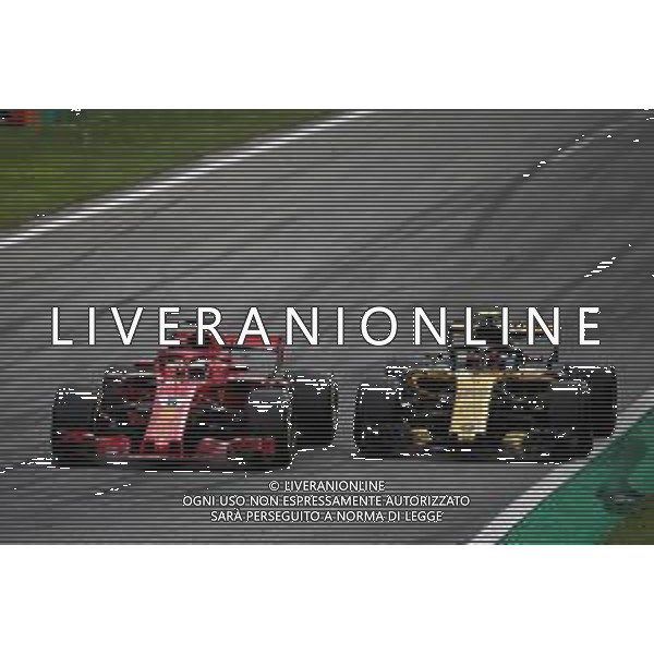 Sebastian Vettel (GER) Ferrari SF71H and Carlos Sainz Jr (ESP) Renault Sport F1 Team RS18 battle for position. 02.09.2018. Formula 1 World Championship, Rd 14, Italian Grand Prix, Monza, Italy, Race Day. / AGENZIA ALDO LIVERANI SAS - ITALY ONLY EDITORIAL USE ONLY