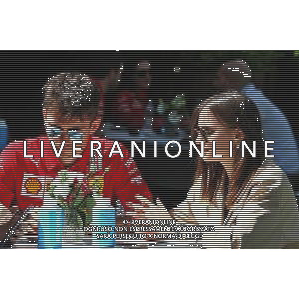 (L to R): Charles Leclerc (MON) Ferrari with his girlfriend Charlotte Sine (MON). 12.03.2020. Formula 1 World Championship, Rd 1, Australian Grand Prix, Albert Park, Melbourne, Australia, Preparation Day. / AGENZIA ALDO LIVERANI SAS - ITALY ONLY EDITORIAL USE ONLY - Charles Leclerc Ferrari F1 with his girlfriend Charlotte Sine\'
