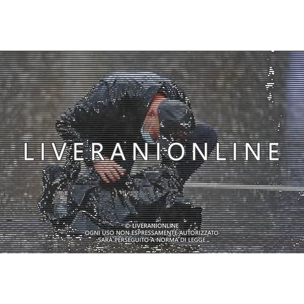 Cameraman - heavy rain in the paddock. 11.07.2020. Formula 1 World Championship, Rd 2, Steiermark Grand Prix, Spielberg, Austria, Qualifying Day. / AGENZIA ALDO LIVERANI SAS - ITALY ONLY EDITORIAL USE ONLY