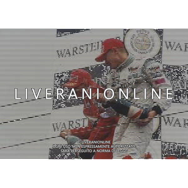 RETROSPETTIVA MICHAEL SCHUMACHER PILOTA F1 NELLA FOTO MICHAEL SCHUMACHER NELL\'ANNO 2000 CON MIKKA HAKKINEN SUL PODIO AG ALDO LIVERANI SAS