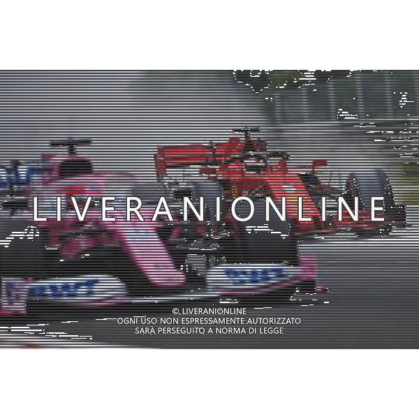Sebastian Vettel (GER) Ferrari SF1000 and Sergio Perez (MEX) Racing Point F1 Team RP19. 18.07.2020. Formula 1 World Championship, Rd 3, Hungarian Grand Prix, Budapest, Hungary, Qualifying Day. / AGENZIA ALDO LIVERANI SAS - ITALY ONLY EDITORIAL USE ONLY