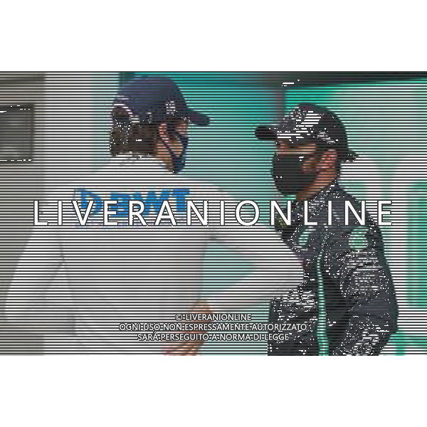 (L to R): Lance Stroll (CDN) Racing Point F1 Team with pole sitter Lewis Hamilton (GBR) Mercedes AMG F1 in qualifying parc ferme. 18.07.2020. Formula 1 World Championship, Rd 3, Hungarian Grand Prix, Budapest, Hungary, Qualifying Day. - www.xpbimages.com, EMail: requests@xpbimages.com - copy of publication required for printed pictures. Every used picture is fee-liable. © Copyright: FIA Pool Image for Editorial Use Only / AGENZIA ALDO LIVERANI SAS - ITALY ONLY EDITORIAL USE ONLY