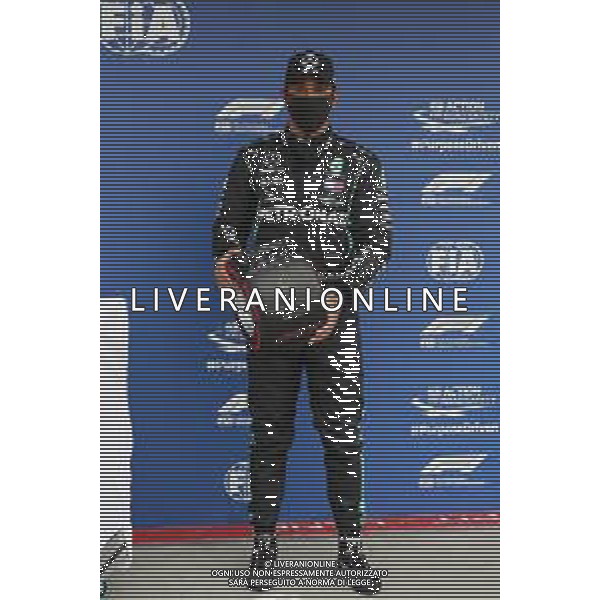Lewis Hamilton (GBR) Mercedes AMG F1 celebrates his pole position in qualifying parc ferme with the Pirelli trophy. 18.07.2020. Formula 1 World Championship, Rd 3, Hungarian Grand Prix, Budapest, Hungary, Qualifying Day. - www.xpbimages.com, EMail: requests@xpbimages.com - copy of publication required for printed pictures. Every used picture is fee-liable. © Copyright: FIA Pool Image for Editorial Use Only / AGENZIA ALDO LIVERANI SAS - ITALY ONLY EDITORIAL USE ONLY