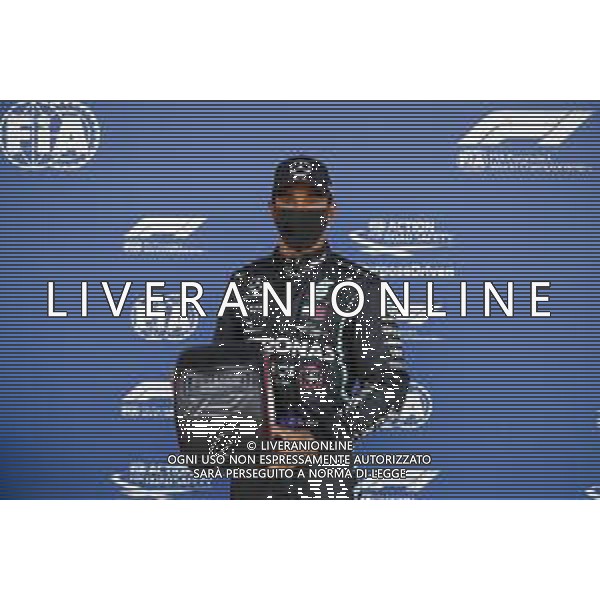Lewis Hamilton (GBR) Mercedes AMG F1 celebrates his pole position in qualifying parc ferme with the Pirelli trophy. 01.08.2020. Formula 1 World Championship, Rd 4, British Grand Prix, Silverstone, England, Qualifying Day. - www.xpbimages.com, EMail: requests@xpbimages.com - copy of publication required for printed pictures. Every used picture is fee-liable. © Copyright: FIA Pool Image for Editorial Use Only / AGENZIA ALDO LIVERANI SAS - ITALY ONLY EDITORIAL USE ONLY