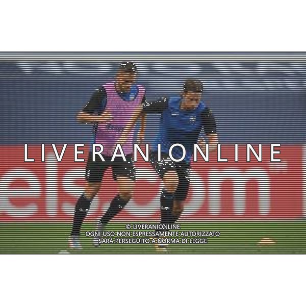 LISBON, PORTUGAL - AUGUST 12: Hans Hateboer and Rafael Toloi of Atalanta warm up prior to the UEFA Champions League Quarter Final match between Atalanta and Paris Saint-Germain at Estadio do Sport Lisboa e Benfica on August 12, 2020 in Lisbon, Portugal. (Photo by Michael Regan - UEFA/UEFA via Getty Images) AG ALDO LIVERANI SAS