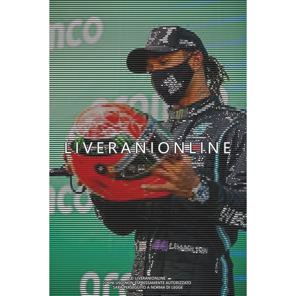 Race winner Lewis Hamilton (GBR) Mercedes AMG F1 with the helmet of Michael Schumacher (GER) by Mick Schumacher (GER) in parc ferme after equalling the record for the number of F1 victories. 11.10.2020. Formula 1 World Championship, Rd 11, Eifel Grand Prix, Nurbugring, Germany, Race Day. - www.xpbimages.com, EMail: requests@xpbimages.com © Copyright: FIA Pool Image for Editorial Use Only/ AGENZIA ALDO LIVERANI SAS - ITALY ONLY EDITORIAL USE ONLY
