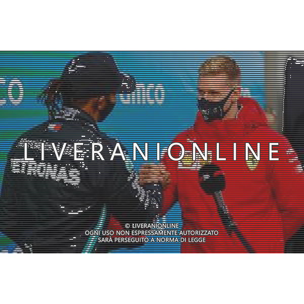 Race winner Lewis Hamilton (GBR) Mercedes AMG F1 is presented with the helmet of Michael Schumacher (GER) by Mick Schumacher (GER) in parc ferme after equalling the record for the number of F1 victories. 11.10.2020. Formula 1 World Championship, Rd 11, Eifel Grand Prix, Nurbugring, Germany, Race Day. - www.xpbimages.com, EMail: requests@xpbimages.com © Copyright: FIA Pool Image for Editorial Use Only/ AGENZIA ALDO LIVERANI SAS - ITALY ONLY EDITORIAL USE ONLY