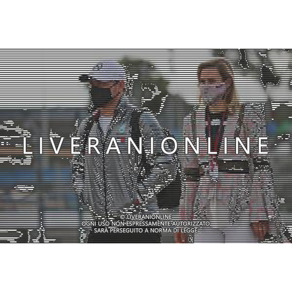 (L to R): Valtteri Bottas (FIN) Mercedes AMG F1 with his girlfriend Tiffany Cromwell (AUS) Professional Cyclist. 23.10.2020. Formula 1 World Championship, Rd 12, Portuguese Grand Prix, Portimao, Portugal, Practice Day. - www.xpbimages.com, EMail: requests@xpbimages.com © Copyright: Batchelor / XPB Images / AGENZIA ALDO LIVERANI SAS - ITALY ONLY EDITORIAL USE ONLY