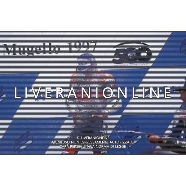 MICHAEL \'MICK\' DOOHAN, PILOTA MOTOCICLISTICA AUSTRALIANO - RETROSPETTIVA NELLA FOTO NEL 1997 AL MUGELLO SUL PODIO ©Controluce Monza/ ARCHIVIO AGENZIA ALDO LIVERANI SAS