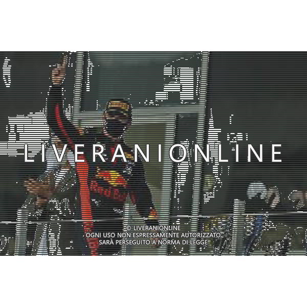 Race winner Max Verstappen (NLD) Red Bull Racing celebrates on the podium. 13.12.2020. Formula 1 World Championship, Rd 17, Abu Dhabi Grand Prix, Yas Marina Circuit, Abu Dhabi, Race Day. - www.xpbimages.com, EMail: requests@xpbimages.com © Copyright: Moy / XPB Images/AGENZIA ALDO LIVERANI SAS - ITALY ONLY EDITORIAL USE ONLY