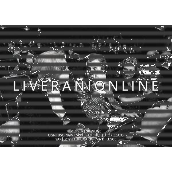 RETROSPETTIVA JOHNNY DORELLI ATTORE E CANTANTE, CONDUTTORE TELEVISIVO, PIANISTA NELLA FOTO JOHNNY DORELLI A MILANO CON CATHERINE SPAAK A UNA SERATA DI PADRE ELIGIO NELL\'ANNO 1974 AG ALDO LIVERANI SAS  