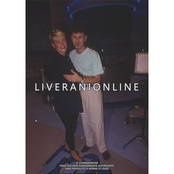 RETROSPETTIVA ROBERTA TERMALI CONDUTTRICE TELEVISIVA NELLA FOTO FABIO FAZIO CON ROBERTA TERMALI NELL\'ANNO 1988 NELLA TRASMISSIONE TELEVISIVA “FORZA ITALIA“ ODEON TV AG ALDO LIVERANI SAS