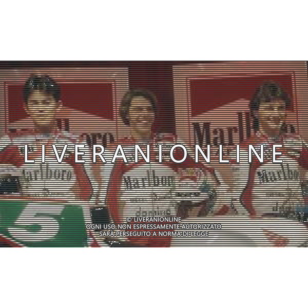 RETROSPETTIVA FAUSTO GRESINI PILOTA MOTOCICLISMO NELLA FOTO FAUSTO GRESINI CON LORIS CAPIROSSI E NOROBU UEDA AG CONTROLUCE-AG ALDO LIVERANI SAS 