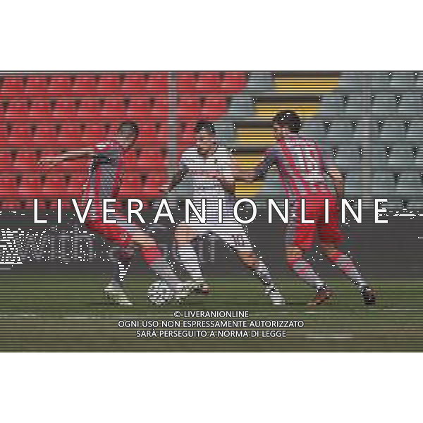 Carnabucia/LMedia - US Cremonese vs AC Reggiana - Italian Football Championship League BKT 2020/2021 13 March 2021 - Giovanni Zini stadium, cremona, Italy Photo showing: Andrea Costa (Reggiana) comes up on both Matteo Bianchetti and Daniele Ciofani (Cremonese) @Carnabucia/LMedia/ AGENZIA ALDO LIVERANI SAS