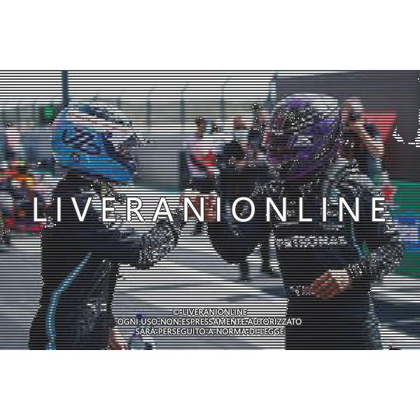 (L to R): Valtteri Bottas (FIN) Mercedes AMG F1 celebrates his pole position in qualifying parc ferme with second placed team mate Lewis Hamilton (GBR) Mercedes AMG F1. 01.05.2021. Formula 1 World Championship, Rd 3, Portuguese Grand Prix, Portimao, Portugal, Qualifying Day. - www.xpbimages.com, EMail: requests@xpbimages.com © Copyright: FIA Pool Image for Editorial Use Only/ AGENZIA ALDO LIVERANI SAS - ITALY ONLY EDITORIAL USE ONLY