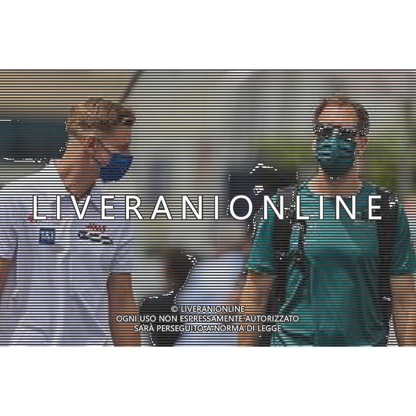 (L to R): Mick Schumacher (GER) Haas F1 Team with Sebastian Vettel (GER) Aston Martin F1 Team. 04.06.2021. Formula 1 World Championship, Rd 6, Azerbaijan Grand Prix, Baku Street Circuit, Azerbaijan, Practice Day. - www.xpbimages.com, EMail: requests@xpbimages.com © Copyright: Charniaux / XPB Images/AGENZIA ALDO LIVERANI SAS - ITALY ONLY EDITORIAL USE ONLY