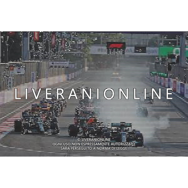 Lewis Hamilton (GBR) Mercedes AMG F1 W12 locks up under braking at the restart of the race while attempting to pass Sergio Perez (MEX) Red Bull Racing RB16B. 06.06.2021. Formula 1 World Championship, Rd 6, Azerbaijan Grand Prix, Baku Street Circuit, Azerbaijan, Race Day. - www.xpbimages.com, EMail: requests@xpbimages.com © Copyright: Batchelor / XPB Images/ AGENZIA ALDO LIVERANI SAS - ITALY ONLY EDITORIAL USE ONLY