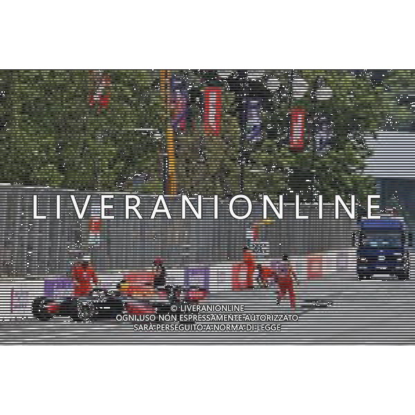 Marshals clear the track after Max Verstappen (NLD) Red Bull Racing RB16B crashed out of the race. 06.06.2021. Formula 1 World Championship, Rd 6, Azerbaijan Grand Prix, Baku Street Circuit, Azerbaijan, Race Day. - www.xpbimages.com, EMail: requests@xpbimages.com © Copyright: Charniaux / XPB Images/ AGENZIA ALDO LIVERANI SAS - ITALY ONLY EDITORIAL USE ONLY