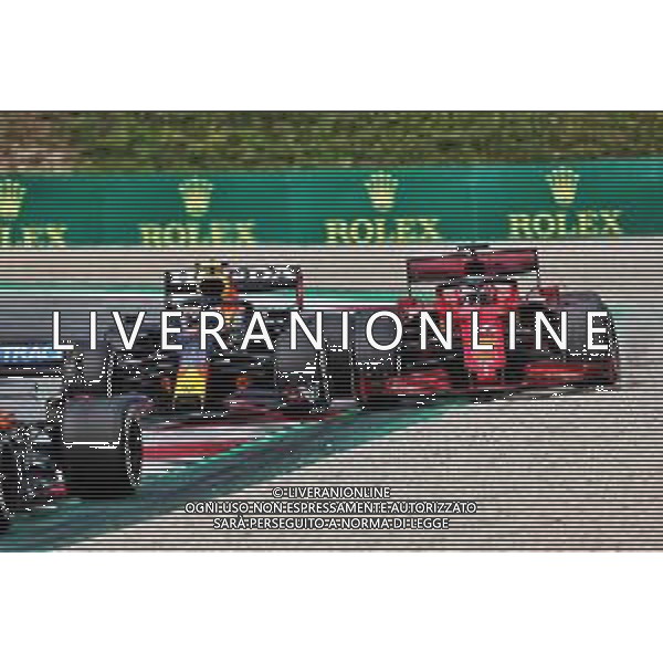 Sergio Perez (MEX) Red Bull Racing RB16B and Charles Leclerc (MON) Ferrari SF-21 battle for position. 04.07.2021. Formula 1 World Championship, Rd 9, Austrian Grand Prix, Spielberg, Austria, Race Day. - www.xpbimages.com, EMail: requests@xpbimages.com © Copyright: Charniaux / XPB Images/AGENZIA ALDO LIVERANI SAS - ITALY ONLY -EDITORIAL USE ONLY