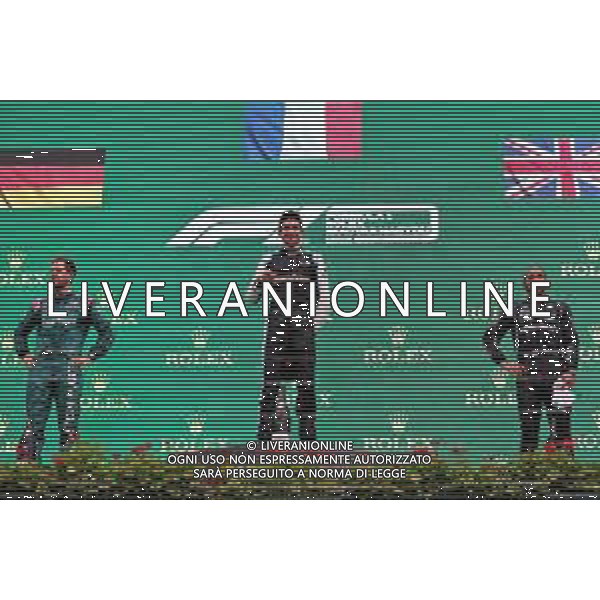 The podium (L to R): Sebastian Vettel (GER) Aston Martin F1 Team, second; Esteban Ocon (FRA) Alpine F1 Team, race winner; Lewis Hamilton (GBR) Mercedes AMG F1, third. 01.08.2021. Formula 1 World Championship, Rd 11, Hungarian Grand Prix, Budapest, Hungary, Race Day. - www.xpbimages.com, EMail: requests@xpbimages.com © Copyright: Charniaux / XPB Images/AGENZIA ALDO LIVERANI SAS - ITALY ONLY EDITORIAL USE ONLY