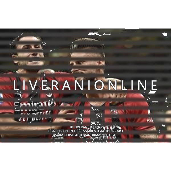 Davide Calabria (Milan) SX e Olivier Giroud (Milan) DX esultano dopo il gol del 4 a 1 Milan vs Cagliari Campionato Serie A TIM - 2a giornata Milano 29-08-2021 Stadio Giuseppe Meazza - San Siro foto Roberto Garavaglia/ag. Aldo Liverani sas