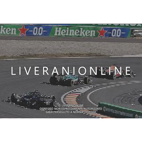 Max Verstappen (NLD) Red Bull Racing RB16B leads Sebastian Vettel (GER) Aston Martin F1 Team AMR21 and Lewis Hamilton (GBR) Mercedes AMG F1 W12. 05.09.2021. Formula 1 World Championship, Rd 13, Dutch Grand Prix, Zandvoort, Netherlands, Race Day. - www.xpbimages.com, EMail: requests@xpbimages.com © Copyright: Batchelor / XPB Images/AGENZIA ALDO LIVERANI SAS - ITALY ONLY EDITORIAL USE ONLY